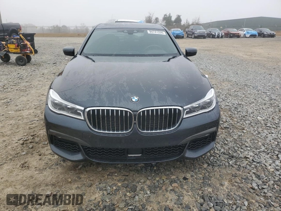 2019 BMW 7 Series 750i with VIN WBA7F0C54KGM25281, listed as a Copart auction lot 84741334 with 76,472 mi miles and Salvage Title. Bid and sale history available at carsss.com. Image 5.
