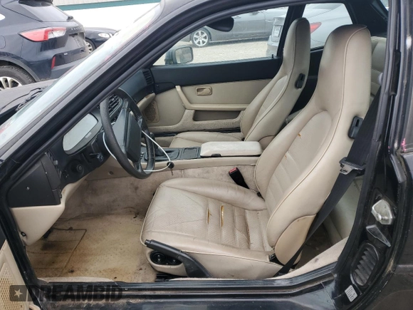 1987 Porsche 944 z VIN WP0AB0944HN473323, wystawiony jako Copart lot #81116104 z przebiegiem 121 255 mil mil oraz Czysty tytuł • Clean title. Historia ofert i sprzedaży dostępna na DreamBid. Obrazek 7.