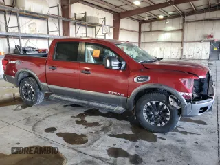 2017 Nissan Titan Platinum Reserve with VIN 1N6AA1E52HN501110, listed as a Copart auction lot 48202935 with 83,674 mi miles and Salvage title. Bid and sale history available at DreamBid. Image 4.
