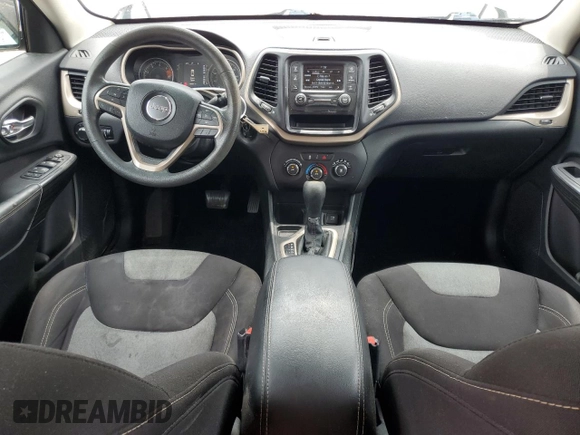 2016 Jeep Cherokee Sport with VIN 1C4PJLAB0GW106601, listed as a Copart auction lot 60854675 with 58,557 mi miles and Salvage title. Bid and sale history available at DreamBid. Image 8.