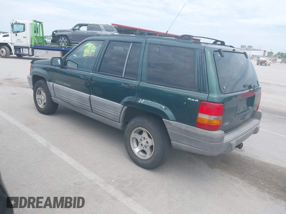 1998 Jeep Grand Cherokee Laredo with VIN 1J4GZ58S7WC284106, listed as a IAAI auction lot 42558498 with 316,354 mi miles and . Bid and sale history available at DreamBid. Image 3.