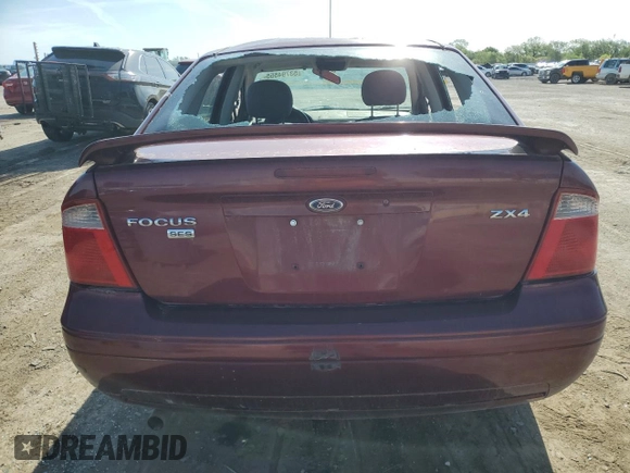 2006 Ford Focus S z VIN 1FAHP34N36W250236, wystawiony jako Copart lot #53794555 z przebiegiem 198 791 mil mil oraz Szkody całkowita. Historia ofert i sprzedaży dostępna na DreamBid. Obrazek 6.