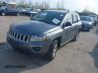 2013 Jeep Compass Sport with VIN 1C4NJCBB2DD174668, listed as a IAAI auction lot 42104977 with 213,123 mi miles. Bid and sale history available at carsss.com. Image 2.