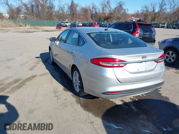 2018 Ford Fusion SE with VIN 3FA6P0LU1JR272522, listed as a IAAI auction lot 41796432 with 123,471 mi miles and . Bid and sale history available at DreamBid. Image 3.