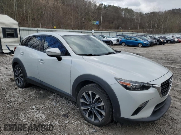 2019 Mazda CX-3 Touring with VIN JM1DKFC78K0405131, listed as a Copart auction lot 87065614 with 91,091 mi miles and Salvage Title. Bid and sale history available at carsss.com. Image 4.