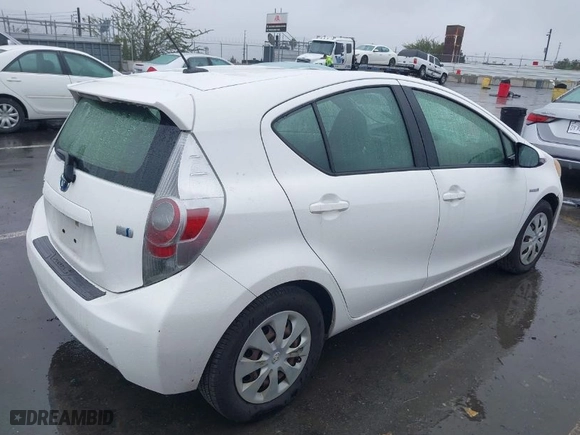 2013 Toyota Prius c One with VIN JTDKDTB36D1544010, listed as a IAAI auction lot 41561964 with 153,572 mi miles. Bid and sale history available at carsss.com. Image 4.