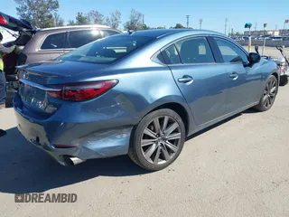 2018 Mazda 6 Grand Touring with VIN JM1GL1TY4J1333021, listed as a IAAI auction lot 41818719 with 56,188 mi miles and . Bid and sale history available at DreamBid. Image 4.