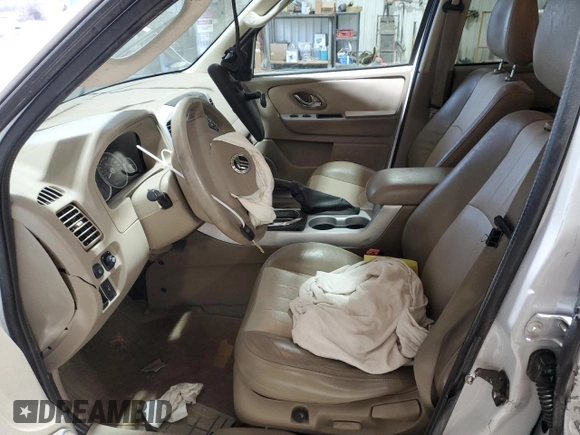 2005 Mercury Mariner Luxury z VIN 4M2CU57145DJ11612, wystawiony jako Copart lot #43980985 z przebiegiem 102 859 mil mil oraz Szkody całkowita. Historia ofert i sprzedaży dostępna na DreamBid. Obrazek 7.