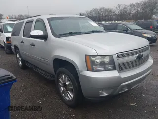 2010 Chevrolet Suburban LTZ with VIN 1GNUCKE04AR187938, listed as a IAAI auction lot 41555621 with 127,516 mi miles. Bid and sale history available at carsss.com. Image 1.