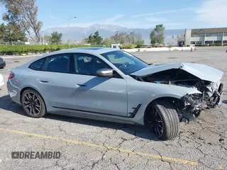 2024 BMW i4 M50 z VIN WBY33AW06RFS45489, wystawiony jako IAAI lot #41981614 z przebiegiem 35 713 mil mil oraz . Historia ofert i sprzedaży dostępna na DreamBid. Obrazek 13.