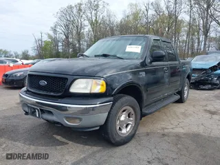 2001 Ford F-150 SuperCrew XLT with VIN 1FTRW08L61KF76055, listed as a IAAI auction lot 42027968 with 301,095 mi miles. Bid and sale history available at carsss.com. Image 2.