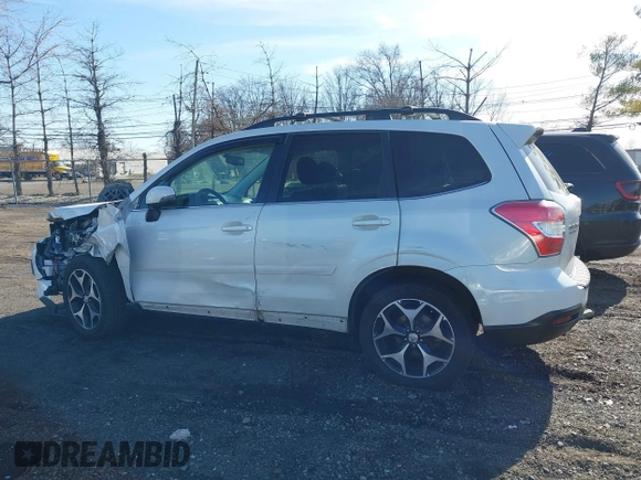 2014 Subaru Forester XT Touring with VIN JF2SJGMC4EH534647, listed as a IAAI auction lot 41828950 with 106,375 mi miles and . Bid and sale history available at DreamBid. Image 14.
