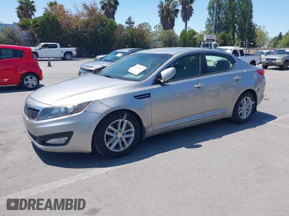 2013 Kia Optima LX with VIN KNAGM4A72D5399117, listed as a IAAI auction lot 42174312 with 105,661 mi miles and . Bid and sale history available at carsss.com. Image 2.