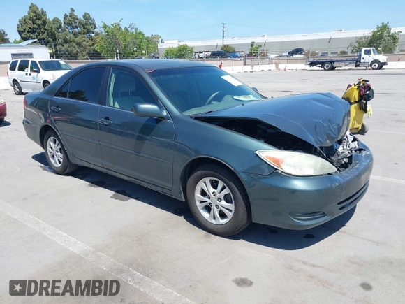 2004 Toyota Camry LE with VIN 4T1BF30K64U067898, listed as a IAAI auction lot 42131958 with 209,702 mi miles. Bid and sale history available at carsss.com. Image 1.
