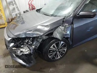 2018 Honda Civic EX-T with VIN JHMFC1F35JX031132, listed as a IAAI auction lot 41591028 with 111,087 mi miles and . Bid and sale history available at DreamBid. Image 6.