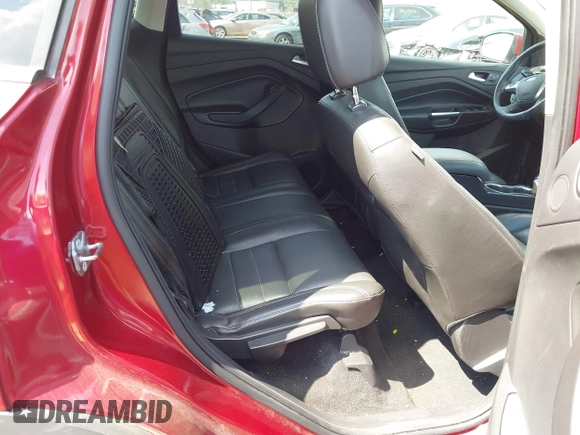 2015 Ford Escape Titanium z VIN 1FMCU9J91FUC58933, wystawiony jako IAAI lot #42583736 z przebiegiem 147 359 mil mil oraz . Historia ofert i sprzedaży dostępna na DreamBid. Obrazek 8.