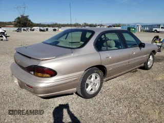 1999 Pontiac Bonneville SE z VIN 1G2HX52K4XH247855, wystawiony jako Copart lot #72559044 z przebiegiem 160 677 mil mil oraz Szkoda całkowita • Salvage title. Historia ofert i sprzedaży dostępna na DreamBid. Obrazek 3.