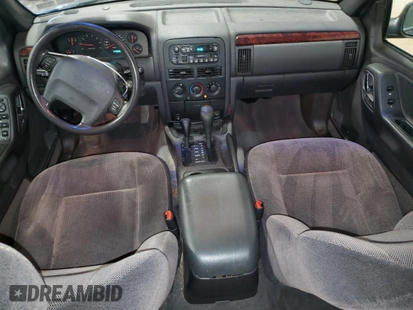 2000 Jeep Grand Cherokee Laredo with VIN 1J4GW48S2YC256123, listed as a Copart auction lot 56015855 with 147,549 mi miles and Salvage title. Bid and sale history available at DreamBid. Image 8.