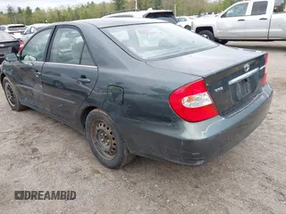2003 Toyota Camry LE z VIN 4T1BE30K13U746690, wystawiony jako IAAI lot #42220794 z przebiegiem 165 807 mil mil oraz . Historia ofert i sprzedaży dostępna na DreamBid. Obrazek 3.