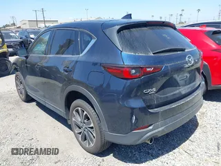2023 Mazda CX-5 S Premium with VIN JM3KFBDM4P0185865, listed as a IAAI auction lot 42040234 with 32,761 mi miles and . Bid and sale history available at DreamBid. Image 3.