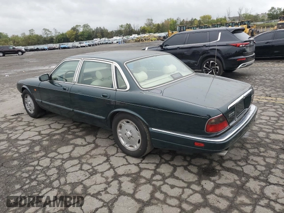 1996 Jaguar XJ with VIN SAJHX1741TC758740, listed as a Copart auction lot 73377914 with 140,964 mi miles and Salvage title. Bid and sale history available at DreamBid. Image 2.