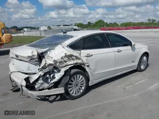 2014 Ford Fusion Energi Titanium with VIN 3FA6P0SU0ER149155, listed as a IAAI auction lot 41519306 with 148,406 mi miles. Bid and sale history available at carsss.com. Image 4.