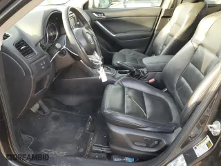 2014 Mazda CX-5 Grand Touring with VIN JM3KE4DY5E0372787, listed as a Copart auction lot 48873675 with 136,784 mi miles and Salvage Title. Bid and sale history available at carsss.com. Image 7.