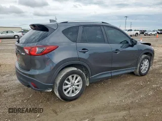 2014 Mazda CX-5 Touring z VIN JM3KE2CY7E0308580, wystawiony jako Copart lot #60565835 z przebiegiem 92 708 mil mil oraz Szkoda całkowita • Salvage title. Historia ofert i sprzedaży dostępna na DreamBid. Obrazek 3.