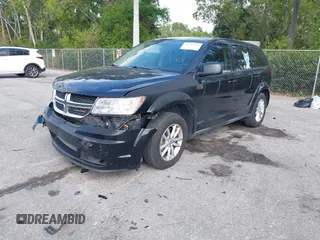 2013 Dodge Journey SE with VIN 3C4PDCAB0DT710609, listed as a IAAI auction lot 41763431 with 145,851 mi miles and . Bid and sale history available at DreamBid. Image 2.