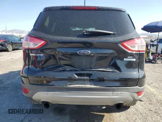 2013 Ford Escape SE with VIN 1FMCU0GX8DUA38056, listed as a Copart auction lot 57617885 with 128,467 mi miles and Salvage title. Bid and sale history available at DreamBid. Image 6.