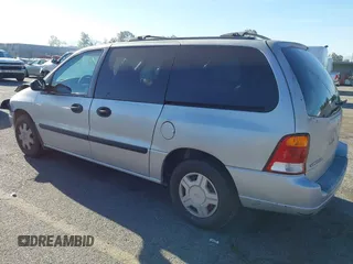 2003 Ford Windstar LX with VIN 2FMZA51413BA16113, listed as a IAAI auction lot 41850359 with 128,768 mi miles and . Bid and sale history available at DreamBid. Image 3.