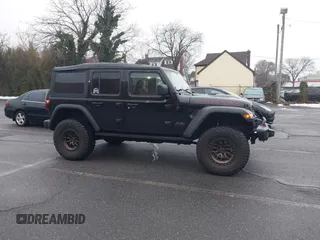 2022 Jeep Wrangler Unlimited Rubicon with VIN 1C4HJXFGXNW127064, listed as a IAAI auction lot 41491203 with 47,700 mi miles and . Bid and sale history available at DreamBid. Image 13.