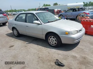 1999 Toyota Corolla VE z VIN 2T1BR12E9XC233078, wystawiony jako IAAI lot #42105935 z przebiegiem 175 977 mil mil oraz . Historia ofert i sprzedaży dostępna na DreamBid. Obrazek 1.