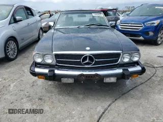1987 Mercedes-Benz 560 with VIN WDBBA48D9HA060044, listed as a Copart auction lot 76965694 with 76,957 mi miles and Non Repairable. Bid and sale history available at carsss.com. Image 5.
