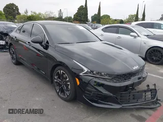 2022 Kia K5 GT-Line z VIN 5XXG64J22NG158351, wystawiony jako IAAI lot #42070902 z przebiegiem 65 083 mil mil oraz . Historia ofert i sprzedaży dostępna na DreamBid. Obrazek 1.
