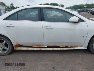 2009 Pontiac G6 1SB with VIN 1G2ZJ57K294240301, listed as a IAAI auction lot 42437339 with 138,984 mi miles and . Bid and sale history available at DreamBid. Image 6.