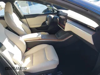 2023 Tesla Model S with VIN 5YJSA1E5XPF500341, listed as a IAAI auction lot 40756406 with 11,583 mi miles and . Bid and sale history available at DreamBid. Image 5.