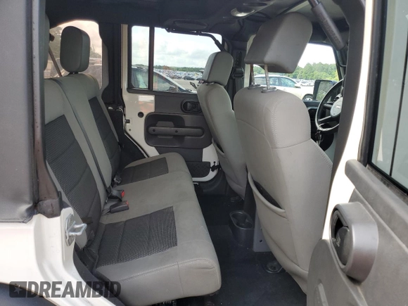 2010 Jeep Wrangler Unlimited Rubicon with VIN 1J4BA6H10AL176014, listed as a Copart auction lot 57092255 with 138,253 mi miles and Salvage title. Bid and sale history available at DreamBid. Image 11.