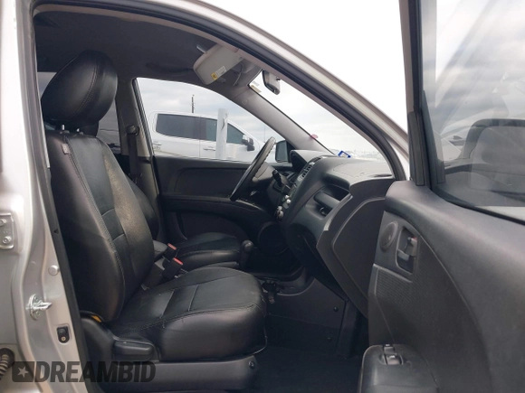 2009 Kia Sportage LX with VIN KNDJF724097567390, listed as a IAAI auction lot 42066762 with 159,946 mi miles. Bid and sale history available at carsss.com. Image 5.