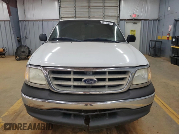 2001 Ford F-150 XL with VIN 1FTRX17L51NB25752, listed as a Copart auction lot 48721235 with 179,941 mi miles and Salvage title. Bid and sale history available at DreamBid. Image 5.