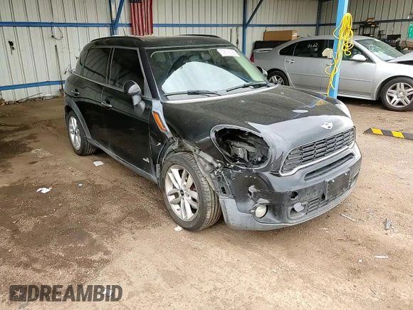 2014 MINI Countryman S with VIN WMWZC5C56EWP38065, listed as a Copart auction lot 59518395 with 91,106 mi miles and Salvage title. Bid and sale history available at DreamBid. Image 13.