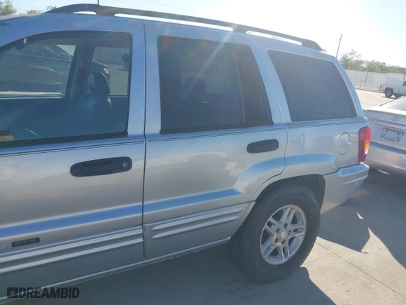 2004 Jeep Grand Cherokee Laredo with VIN 1J4GX48NX4C403936, listed as a IAAI auction lot 40855256 with 241,290 mi miles. Bid and sale history available at carsss.com. Image 6.