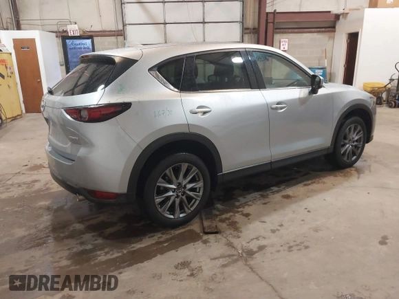 2021 Mazda CX-5 Grand Touring with VIN JM3KFADMXM1318015, listed as a IAAI auction lot 41221528 with 79,473 mi miles. Bid and sale history available at carsss.com. Image 4.