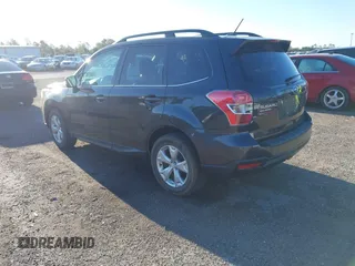 2014 Subaru Forester 2.5i Touring with VIN JF2SJAMC1EH452856, listed as a IAAI auction lot 41801406 with 148,342 mi miles. Bid and sale history available at carsss.com. Image 3.