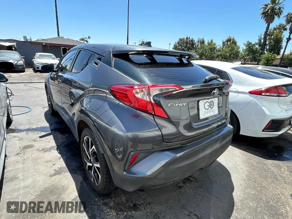 2018 Toyota C-HR XLE with VIN NMTKHMBX1JR004008, listed as a Copart auction lot 61504265 with 106,802 mi miles and Clean title. Bid and sale history available at DreamBid. Image 3.