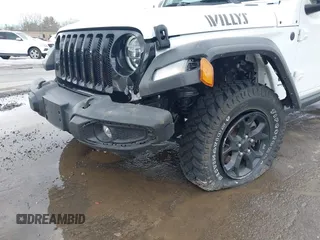 2022 Jeep Wrangler Unlimited Sport S with VIN 1C4HJXDG3NW155467, listed as a IAAI auction lot 41638650 with 22,698 mi miles and . Bid and sale history available at DreamBid. Image 6.