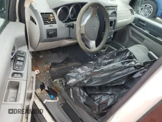 2009 Dodge Grand Caravan SE z VIN 1D8HN44E49B520433, wystawiony jako Copart lot #59439605 z przebiegiem Nie podano mil oraz Szkoda całkowita • Salvage title. Historia ofert i sprzedaży dostępna na DreamBid. Obrazek 8.