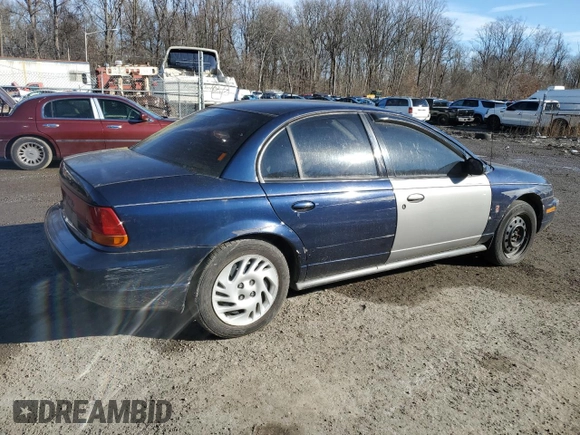 1999 Saturn SL with VIN 1G8ZK5270XZ184042, listed as a Copart auction lot 86827254 with Not Provided miles and Salvage Title. Bid and sale history available at carsss.com. Image 3.