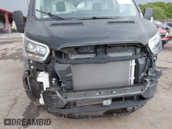 2022 Ford Transit Cargo z VIN 1FTBF4UG4NKA60882, wystawiony jako IAAI lot #42255992 z przebiegiem 2 977 mil mil oraz . Historia ofert i sprzedaży dostępna na DreamBid. Obrazek 18.