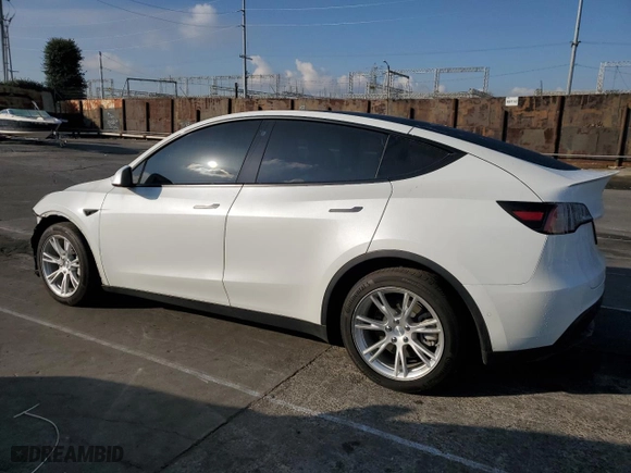 2021 Tesla Model Y Long Range with VIN 5YJYGAEE0MF251598, listed as a Copart auction lot 42151475 with 64,459 mi miles and Salvage Title. Bid and sale history available at carsss.com. Image 2.